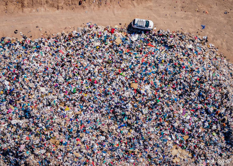 Clothes dumped in the Atacama desert in Chile, as a result of fast fashion. Photo by Antonio Cossio.